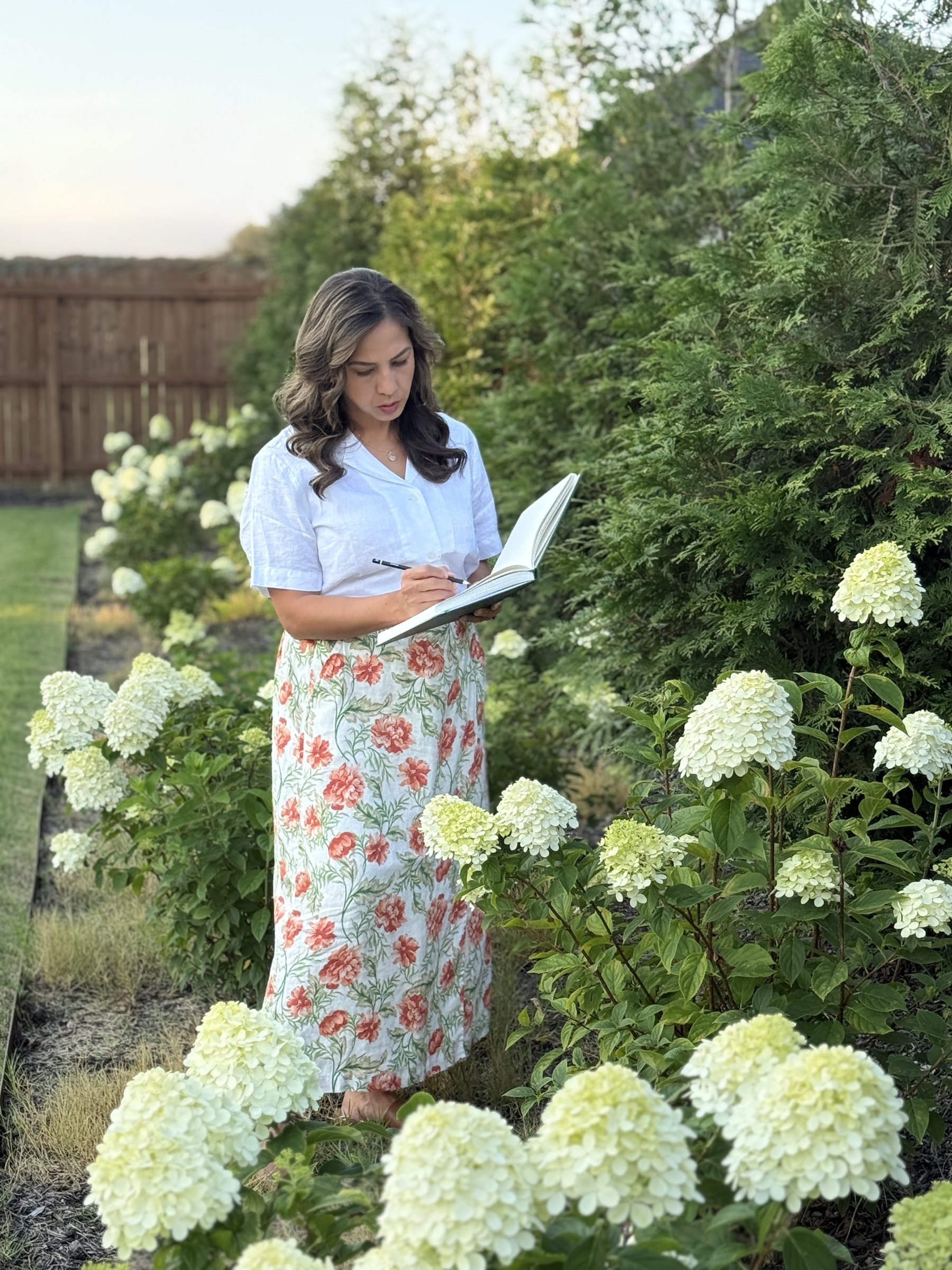 Amber Michelle sketching in her garden